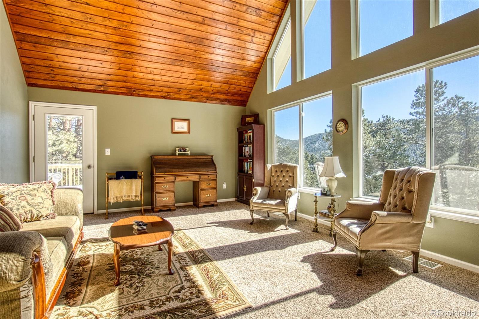 25681 Mosier Circle Conifer, CO 80433 - Photo 12 of 29 a living room filled with furniture