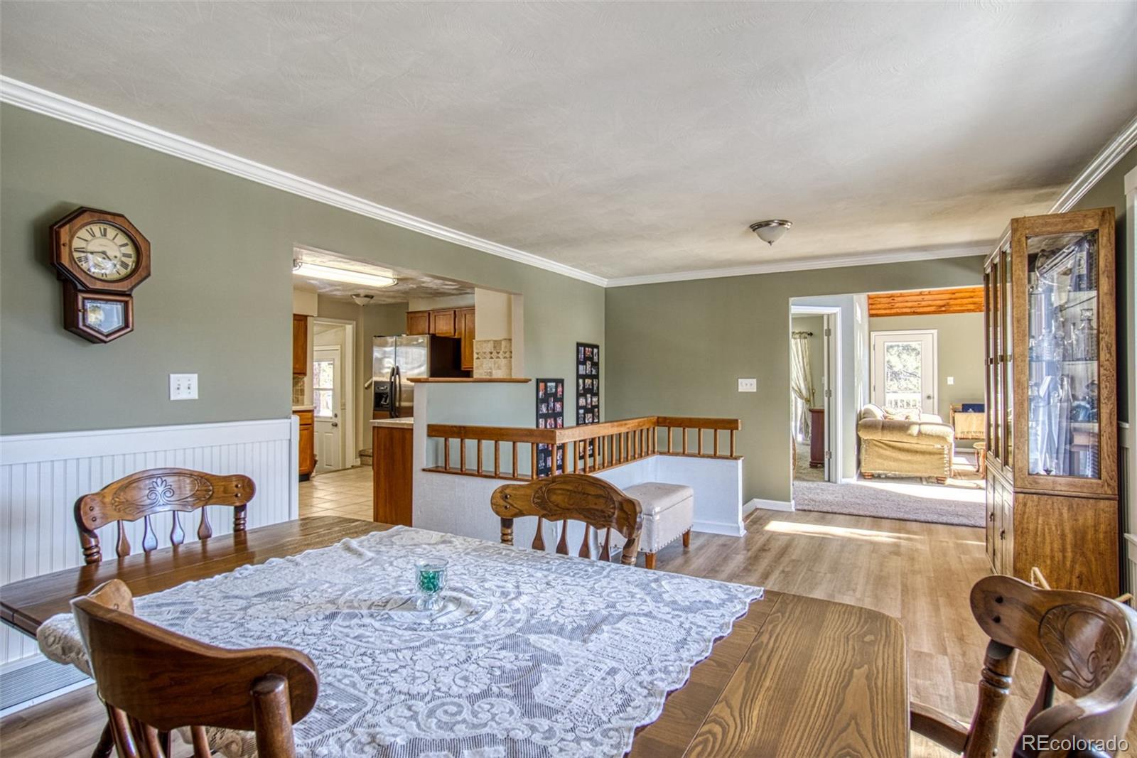 25681 Mosier Circle Conifer, CO 80433 - Photo 15 of 29 a living room with furniture and wooden floor