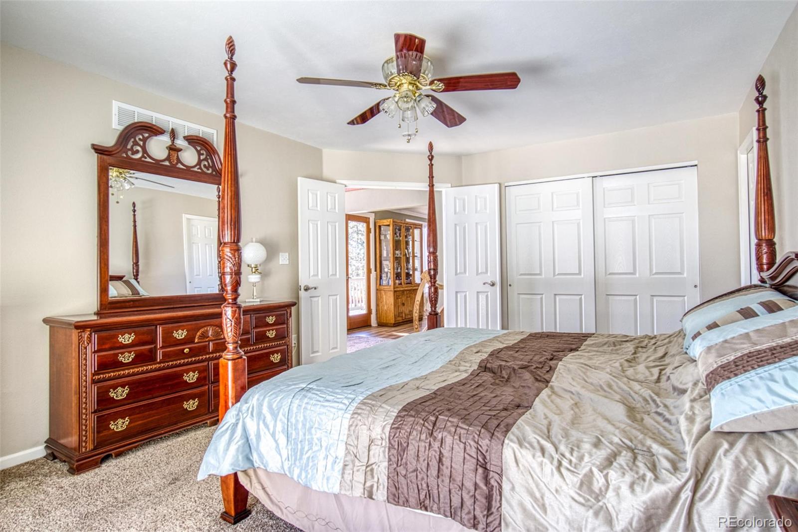 25681 Mosier Circle Conifer, CO 80433 - Photo 23 of 29 a bedroom with a bed and a dresser