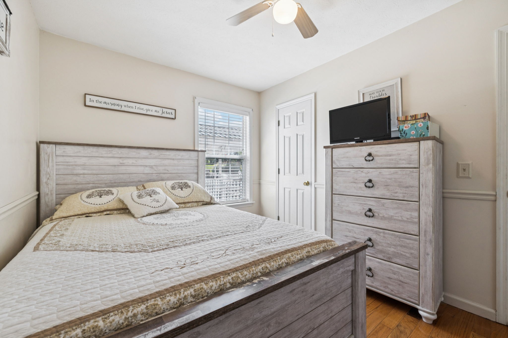 7341 Ruby Keith Road White House, TN 37188 - Photo 20 of 36 a bedroom with a bed and a flat screen tv