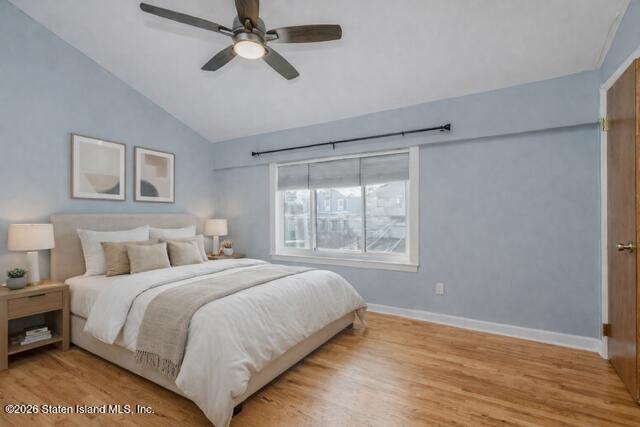 101 Beach Street Staten Island, NY 10304 - Photo 12 of 20 a bedroom with a bed and a window