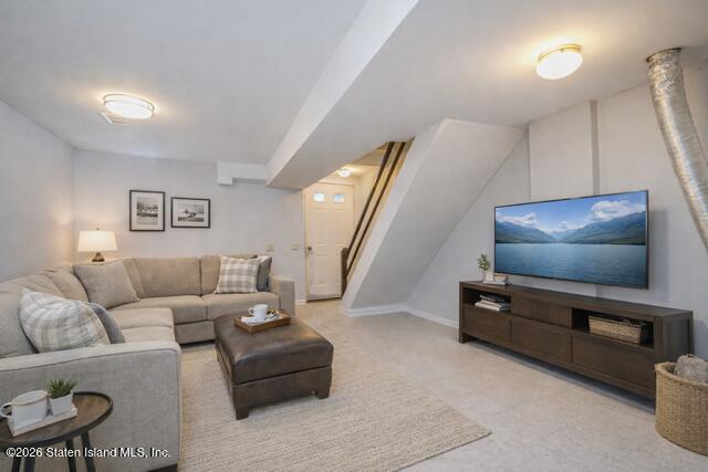 101 Beach Street Staten Island, NY 10304 - Photo 15 of 20 a living room with furniture and a flat screen tv