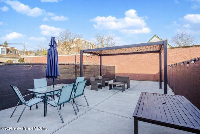 101 Beach Street Staten Island, NY 10304 - Photo 20 of 20 a view of a terrace with furniture and city view