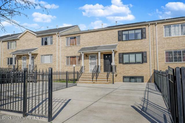 101 Beach Street Staten Island, NY 10304 - Photo 2 of 20 a view of a brick house with many windows