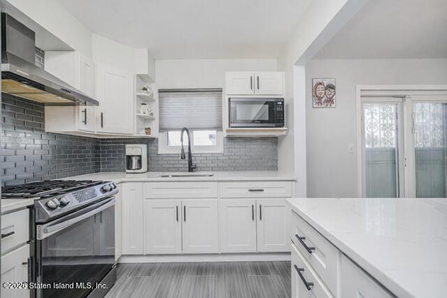 101 Beach Street Staten Island, NY 10304 - Photo 6 of 20 a kitchen with cabinets appliances and a counter space