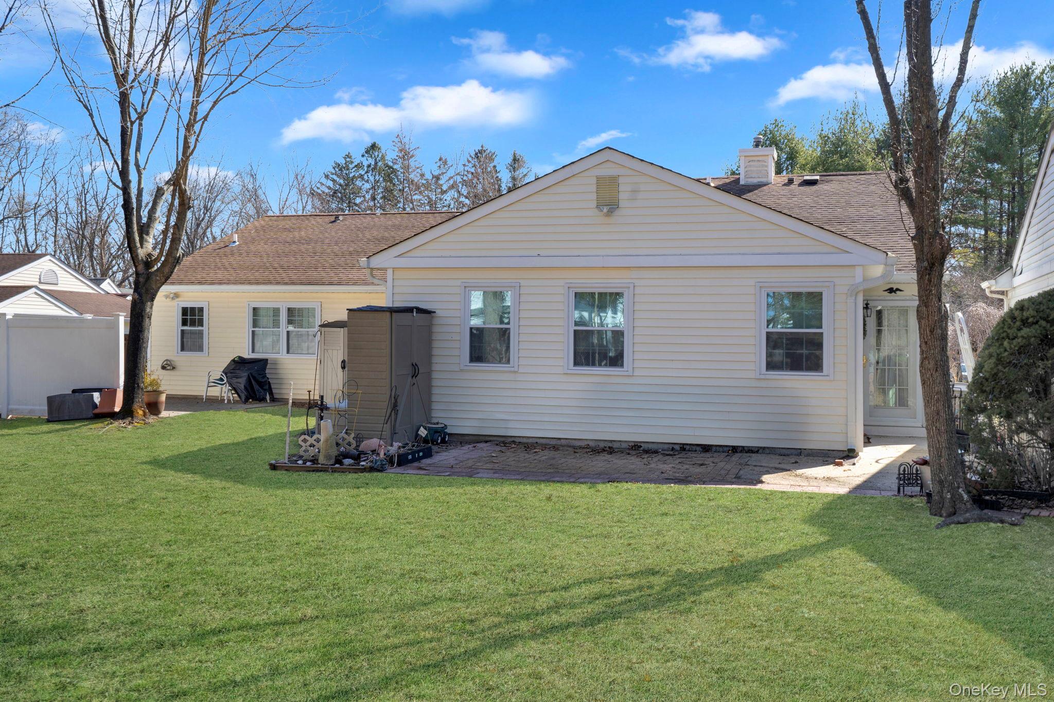 11 Chipmunk Trail Coram, NY 11727 - Photo 3 of 21 a front view of a house with garden