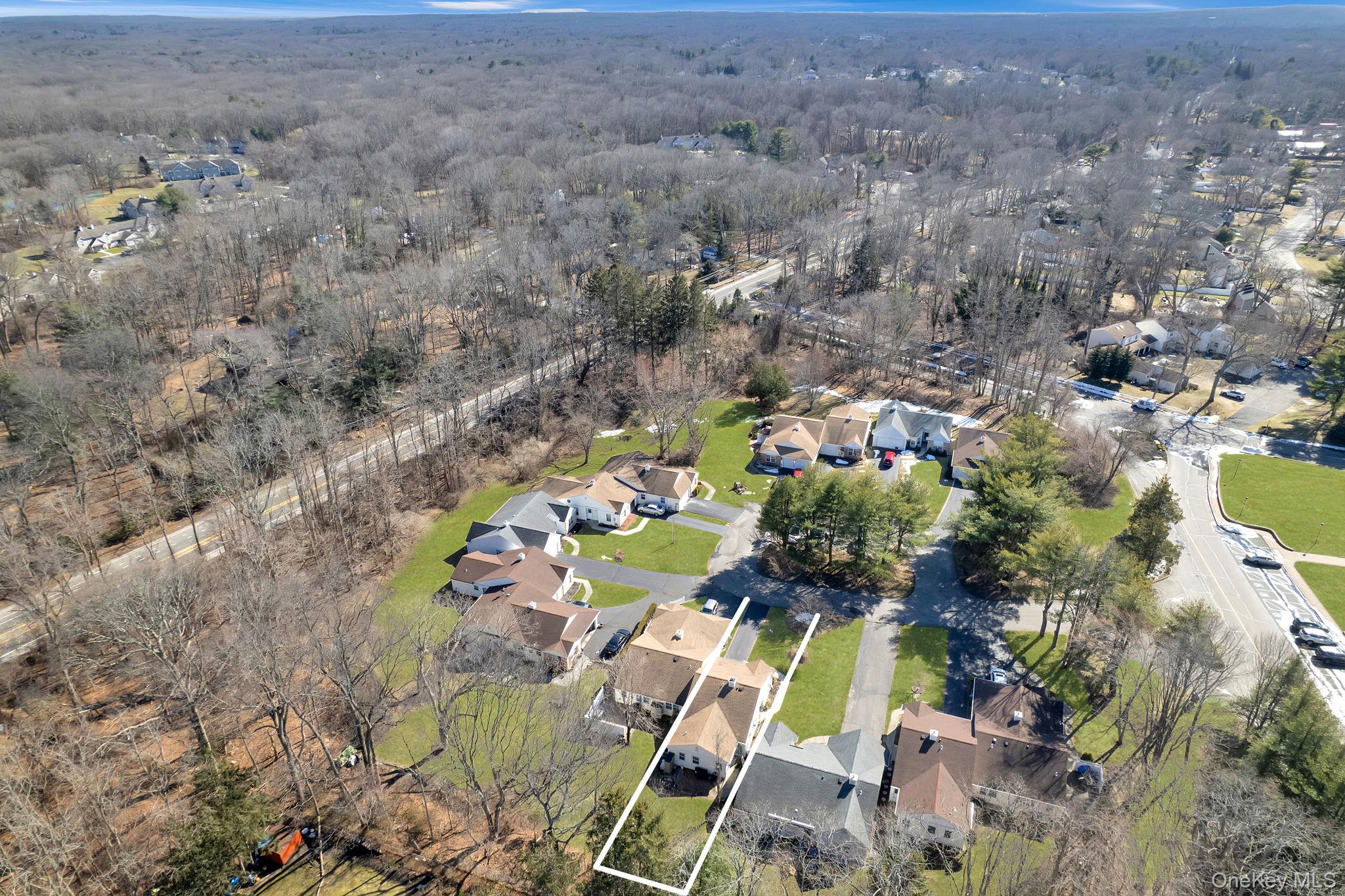 11 Chipmunk Trail Coram, NY 11727 - Photo 5 of 21 an aerial view of residential houses with outdoor space