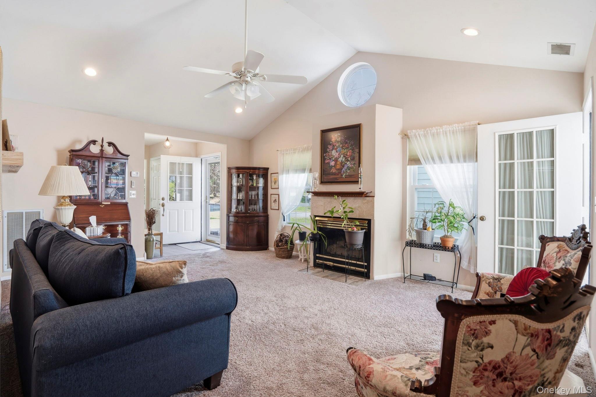 11 Chipmunk Trail Coram, NY 11727 - Photo 6 of 21 a living room with furniture and a fireplace