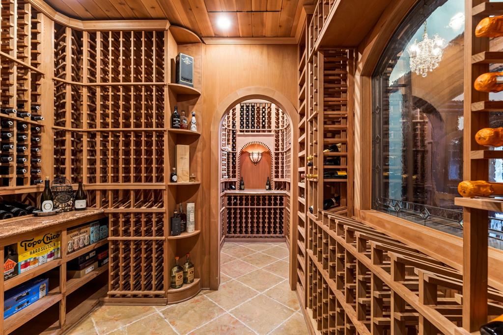 6413 Old Gate Road Plano, TX 75024 - Photo 16 of 39 Climate-controlled wine cellar offering 2,200+ bottle capacity.