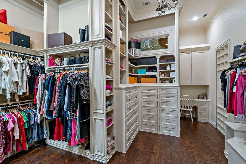 6413 Old Gate Road Plano, TX 75024 - Photo 25 of 35 a view of walk in closet with clothes and shoes