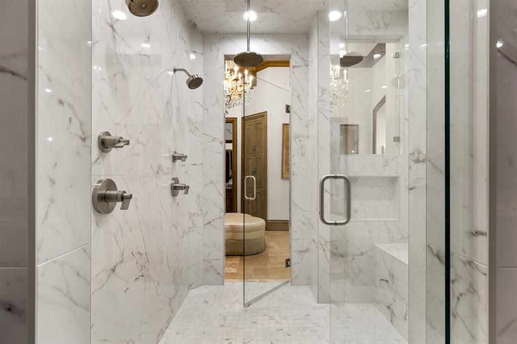 6413 Old Gate Road Plano, TX 75024 - Photo 26 of 39 Primary shower with frameless glass doors for effortless walk-through access.