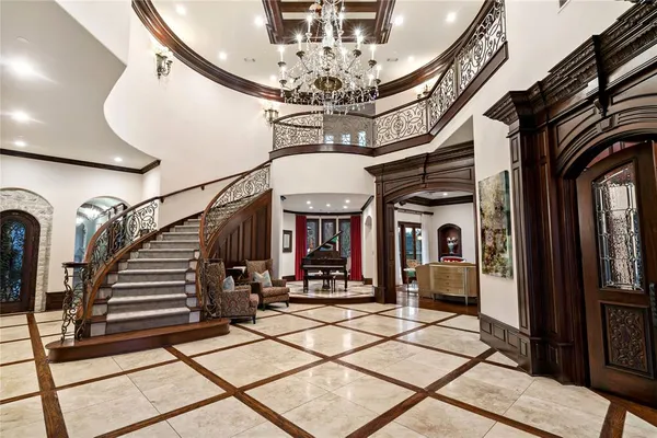 a living room with fireplace furniture and a large window