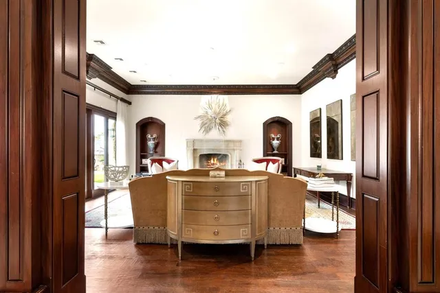 a living room with furniture tv and a large window