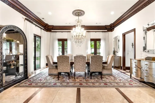 a large kitchen with a table and chairs