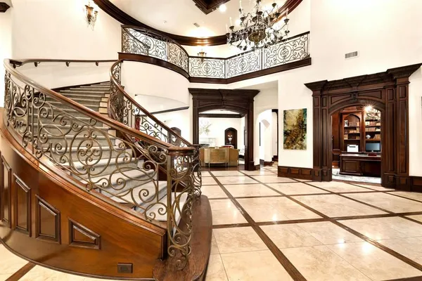 a dining room with furniture a fireplace and wooden floor