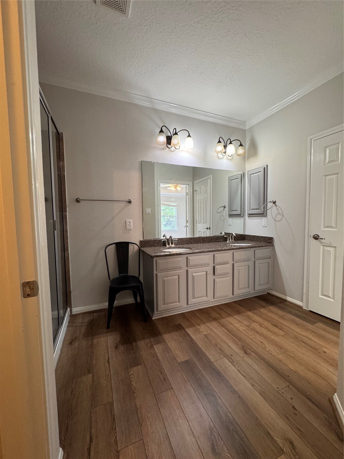 137 East Montfair Boulevard Spring, TX 77382 - Photo 13 of 23 a large kitchen with a lot of counter space and a wooden floor