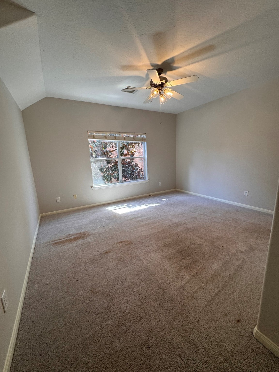137 East Montfair Boulevard Spring, TX 77382 - Photo 18 of 23 an empty room with windows and fan