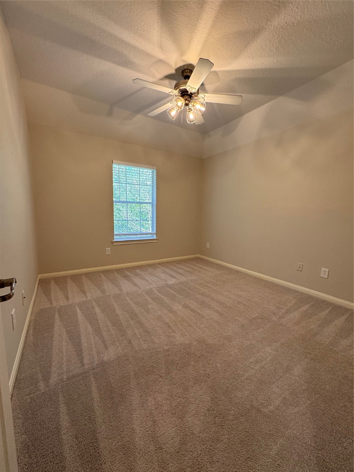 137 East Montfair Boulevard Spring, TX 77382 - Photo 21 of 23 an empty room with windows and fan