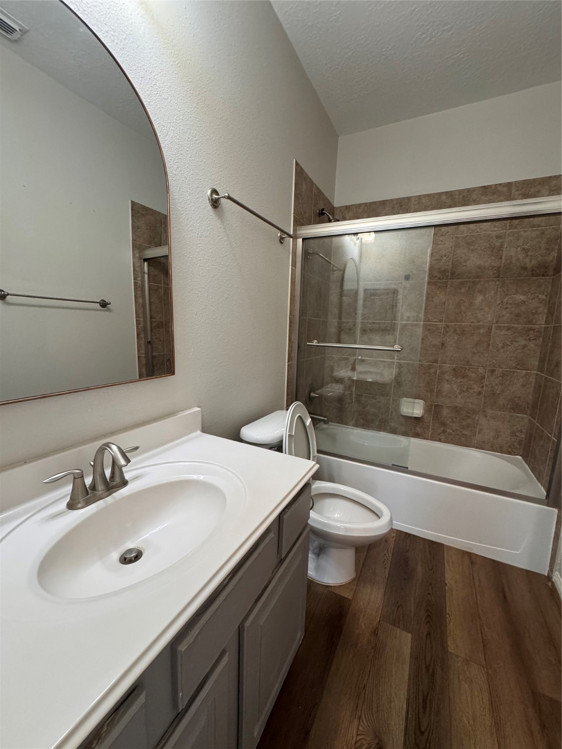 137 East Montfair Boulevard Spring, TX 77382 - Photo 22 of 23 a bathroom with a sink a toilet and shower