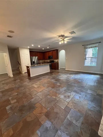 a view of a kitchen with a sink and a fireplace
