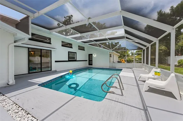 a view of a patio with a table and chairs