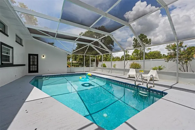 a view of a backyard with a patio and plants
