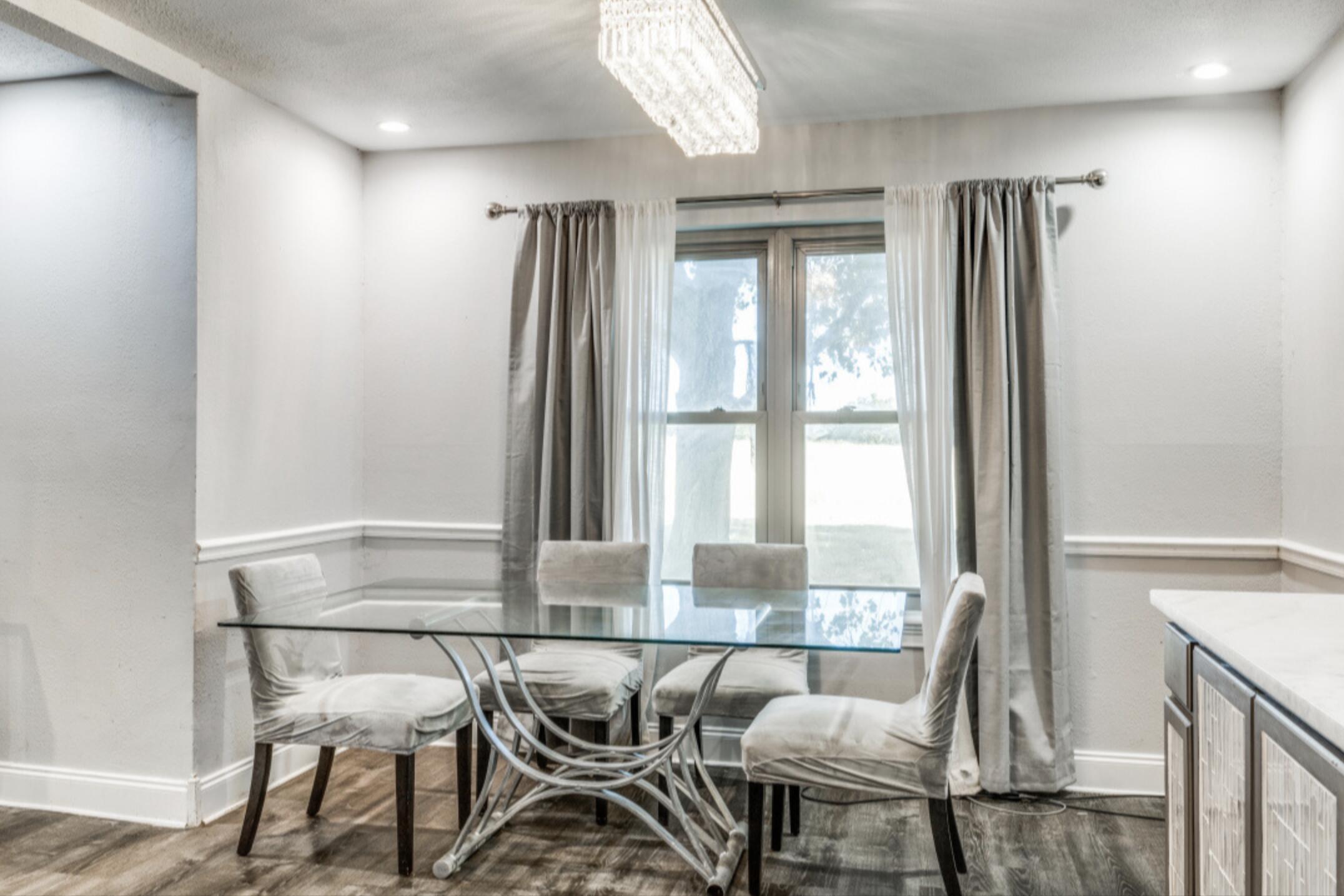 610 Pleasant Grove Road Elgin, TX 78621 - Photo 12 of 25 Dining space with suspended lighting and dark wood finished floors