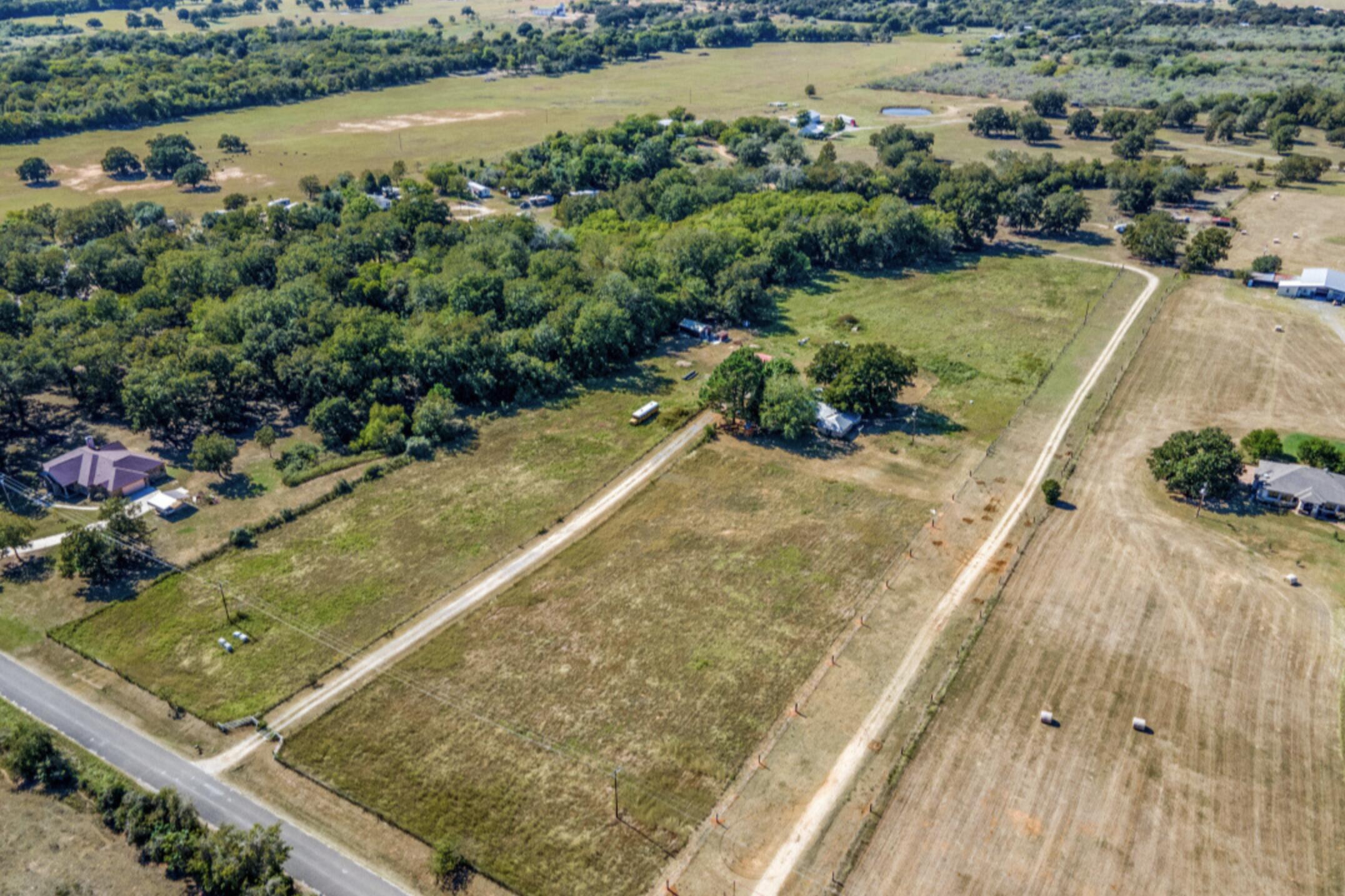 610 Pleasant Grove Road Elgin, TX 78621 - Photo 2 of 25 Aerial overview of property's location with rural landscape