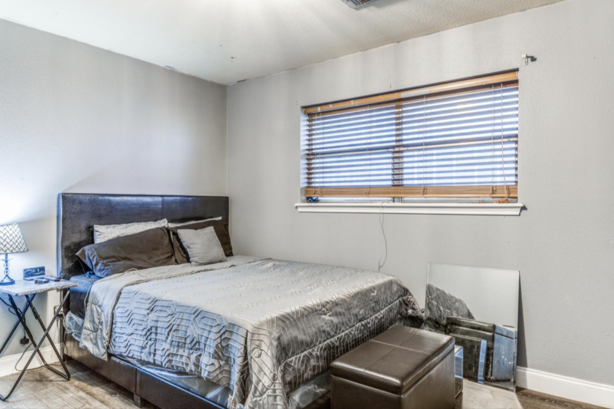 610 Pleasant Grove Road Elgin, TX 78621 - Photo 23 of 25 Bedroom with baseboards and wood finished floors