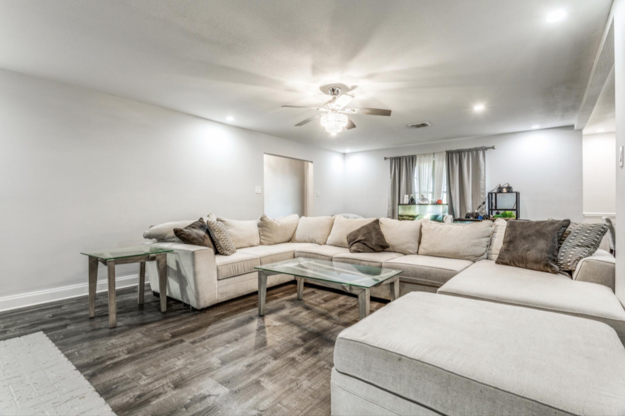 610 Pleasant Grove Road Elgin, TX 78621 - Photo 5 of 25 Living area featuring dark wood finished floors, recessed lighting, and a ceiling fan