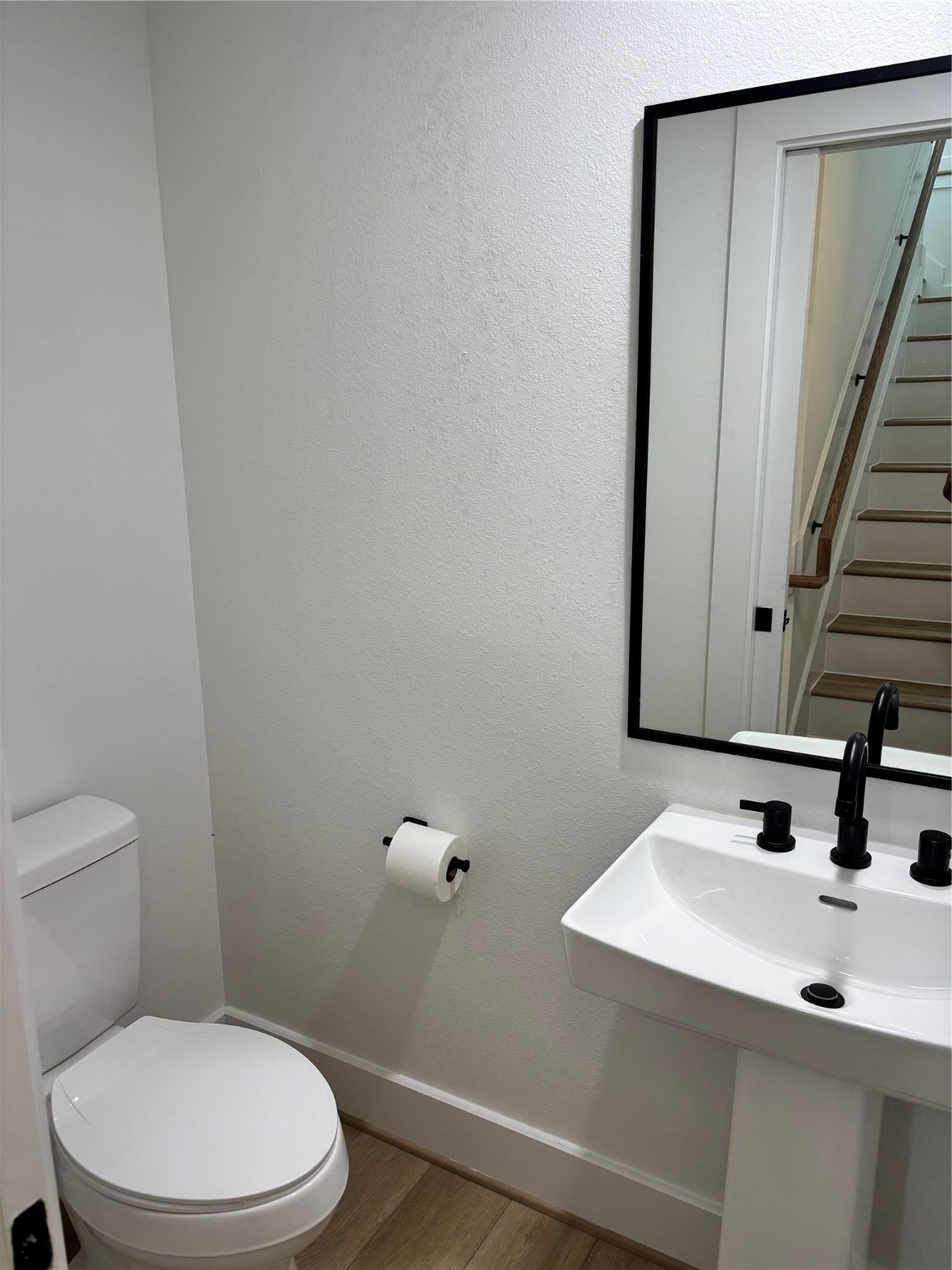 1034 Marcolin Street Houston, TX 77088 - Photo 11 of 25 Half bath between the 2nd and 3rd floor