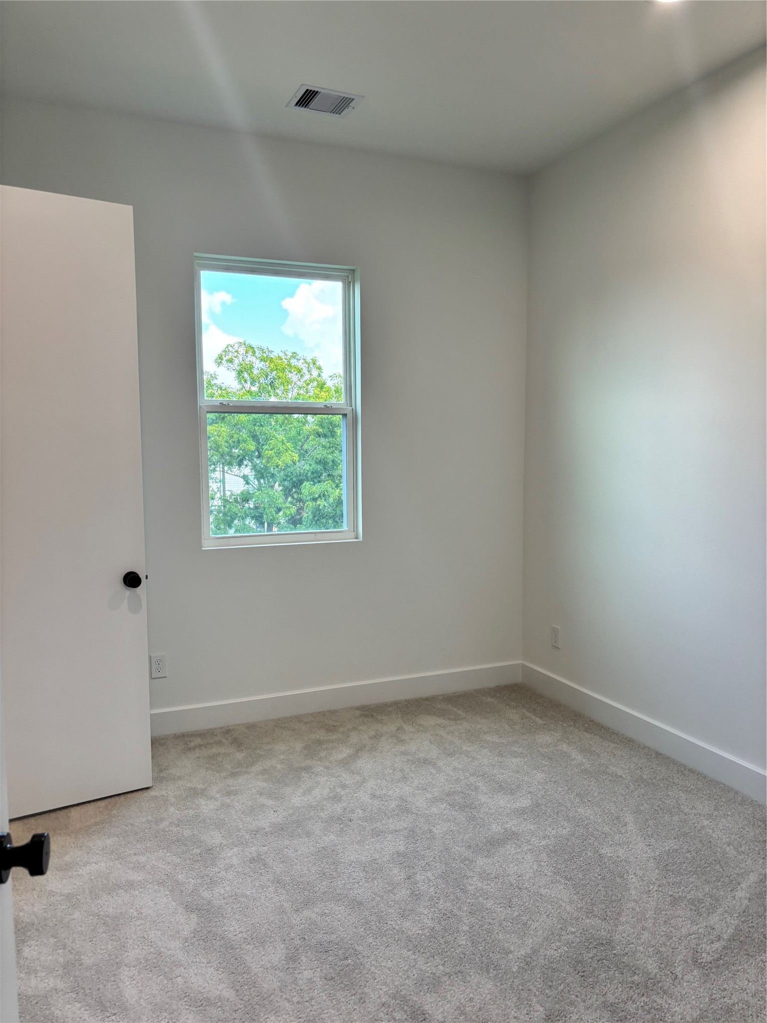 1034 Marcolin Street Houston, TX 77088 - Photo 12 of 25 an empty room with a window