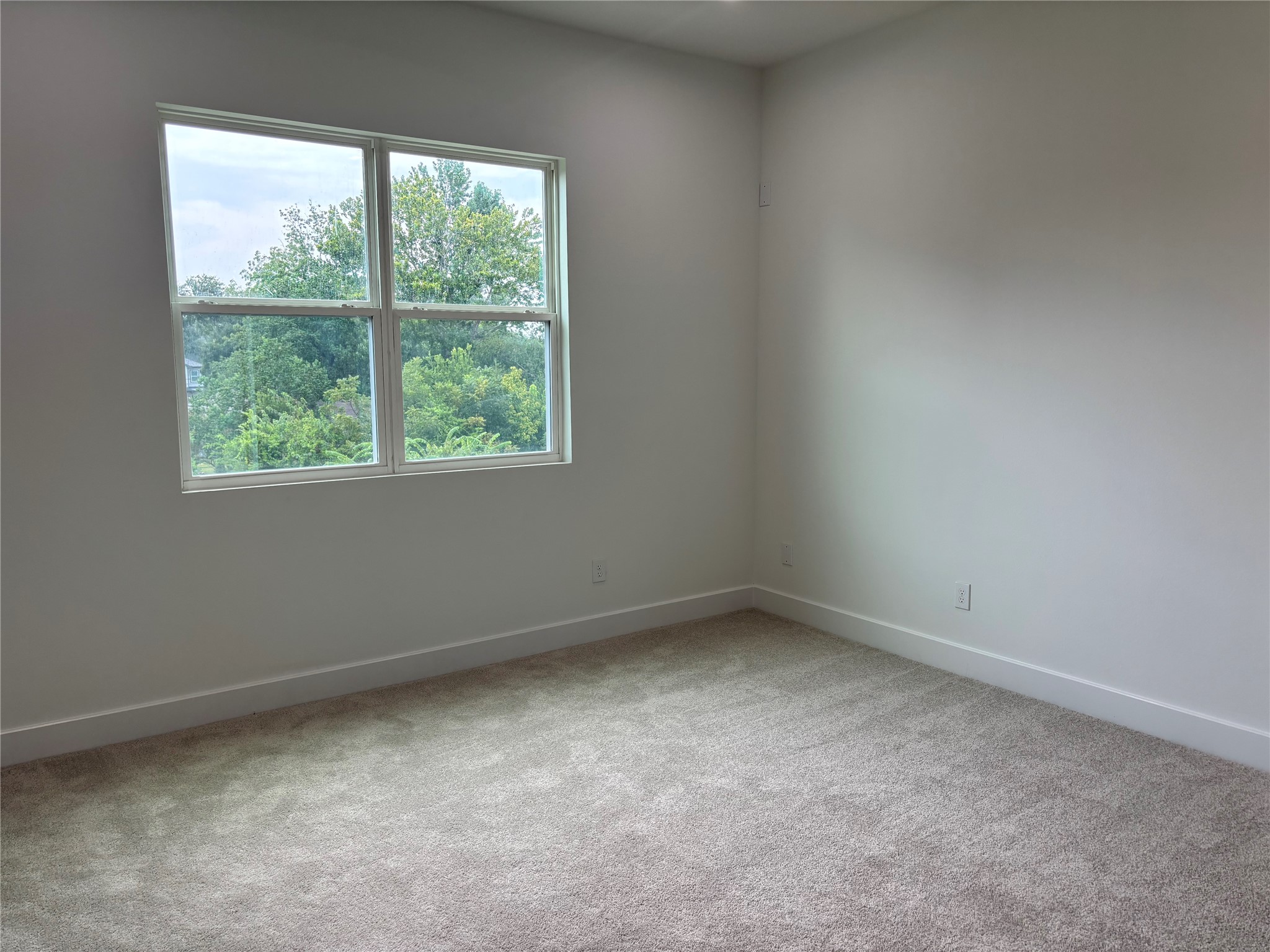 1034 Marcolin Street Houston, TX 77088 - Photo 8 of 25 an empty room with a window