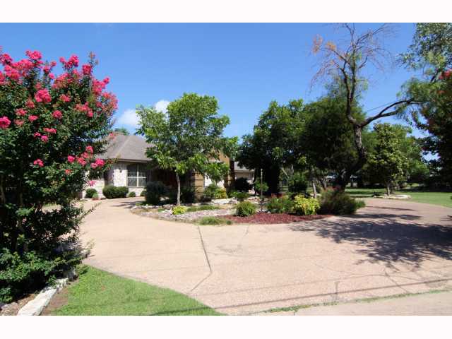 2 Pillow Road Sunset Valley, TX 78745 - Photo 1 of 1 a front view of a house with a yard and garage