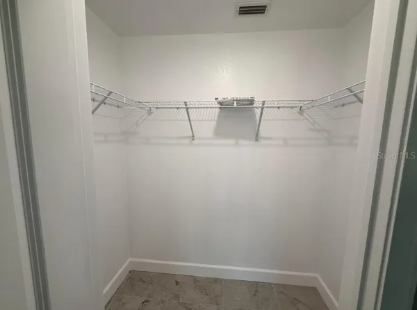a view of an empty walk in closet