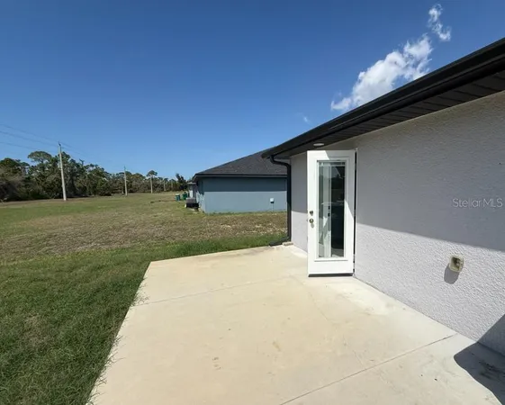 a view of backyard with large trees