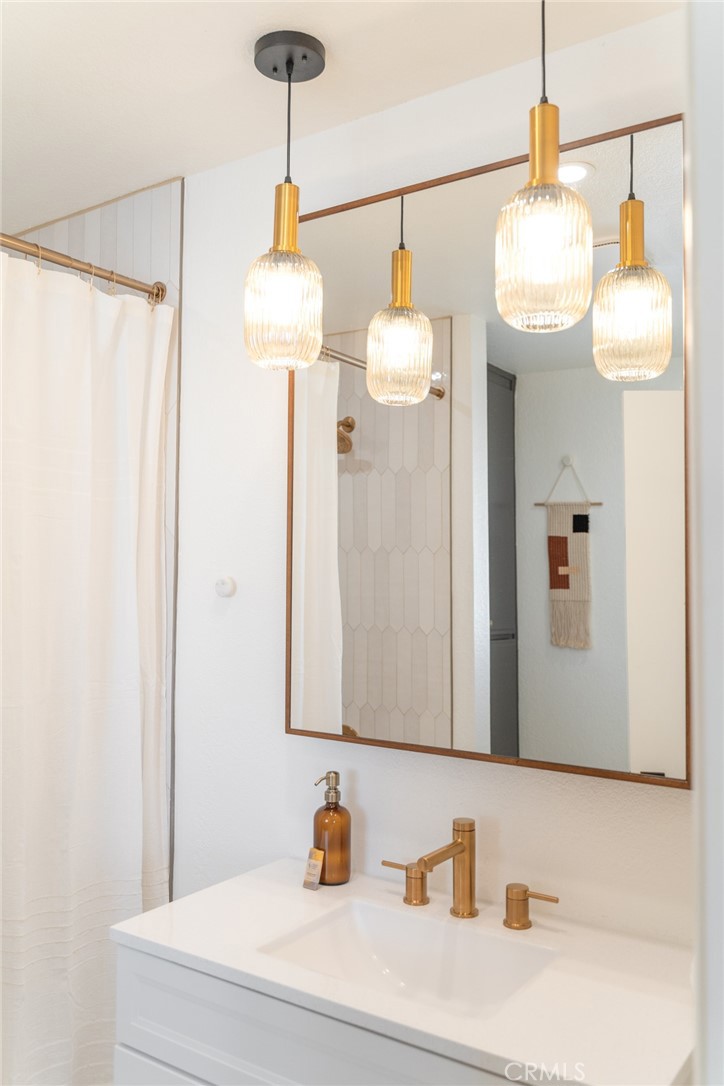 57508 Buena Suerte Road Yucca Valley, CA 92284 - Photo 39 of 61 a bathroom with a sink and a mirror