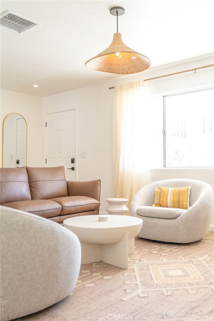 57508 Buena Suerte Road Yucca Valley, CA 92284 - Photo 41 of 61 a living room with furniture and a bathtub