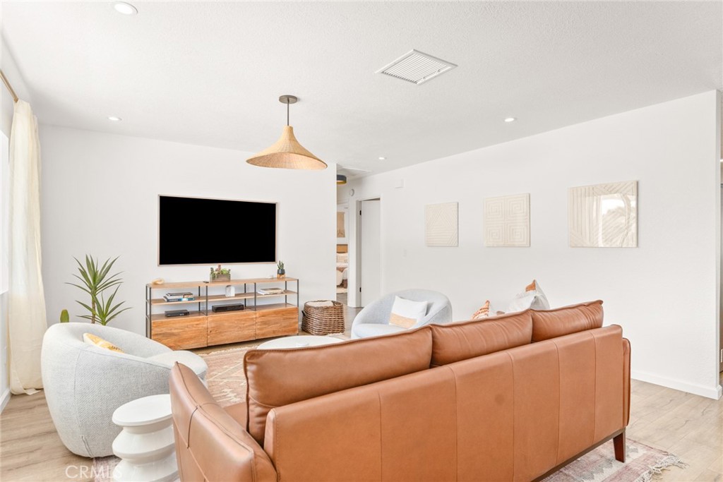 57508 Buena Suerte Road Yucca Valley, CA 92284 - Photo 6 of 61 a living room with furniture and a flat screen tv
