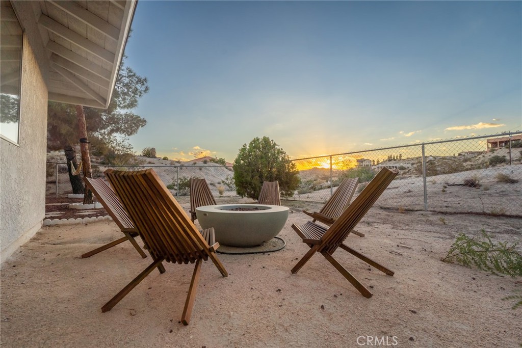 57508 Buena Suerte Road Yucca Valley, CA 92284 - Photo 61 of 61 a view of a roof deck with chair and wooden floor