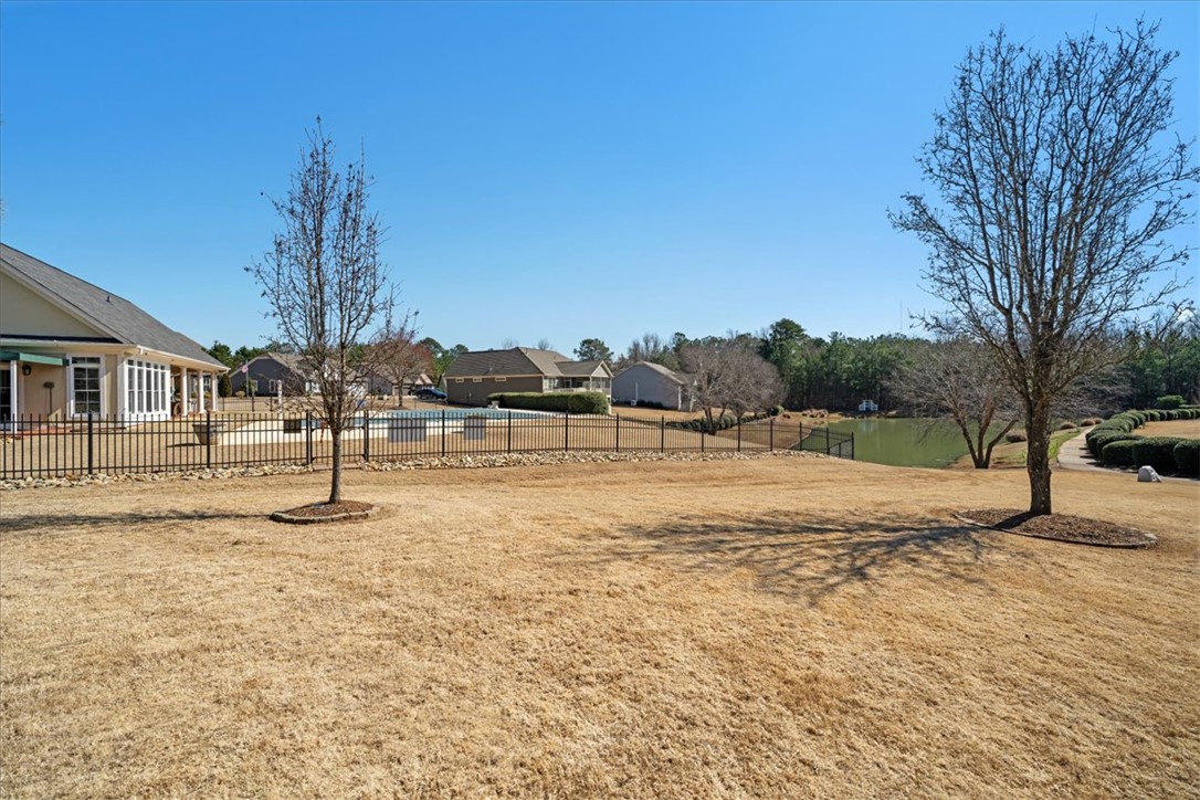 38 Angus Run Seneca, SC 29672 - Photo 4 of 46 This spacious yard offers ample outdoor living space with a private pool and scenic lake views.