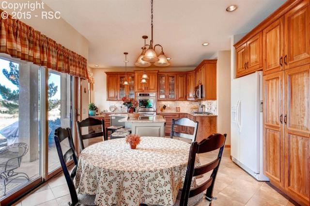 911 Forest View Road Monument, CO 80132 - Photo 7 of 9 KT Eating Area with walkout to Patio