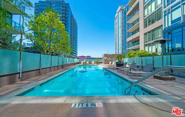 a view of a swimming pool with a lounge chairs