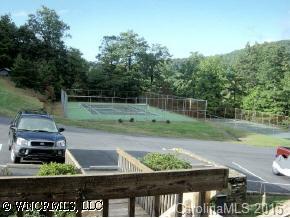 11 B White Oak Mountain Road Columbus, NC 28722 - Photo 7 of 8 a view of a yard with wooden fence