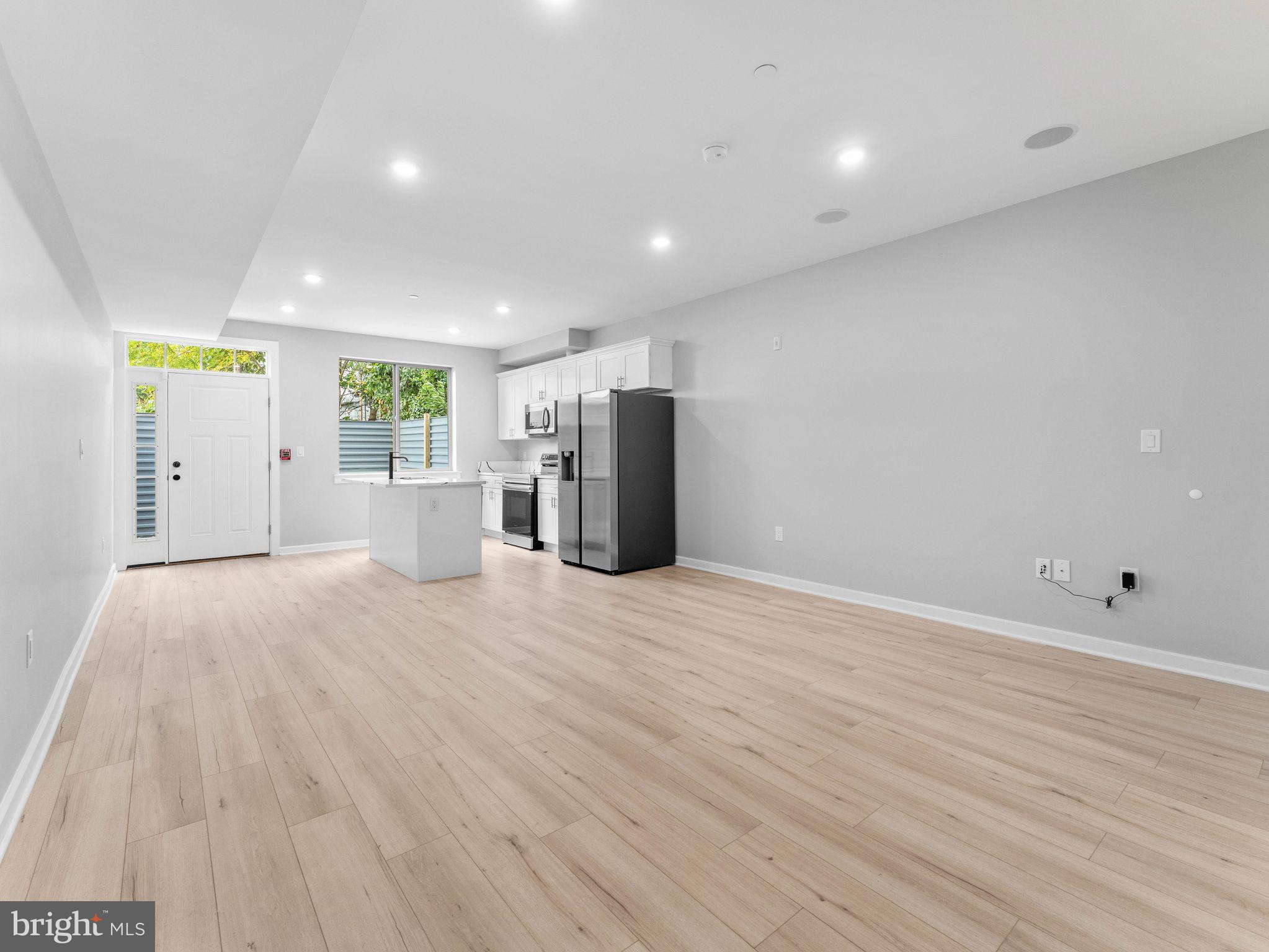 1682 North 54th Street, Unit 2 Philadelphia, PA 19131 - Photo 3 of 15 a view of a big room with wooden floor and windows