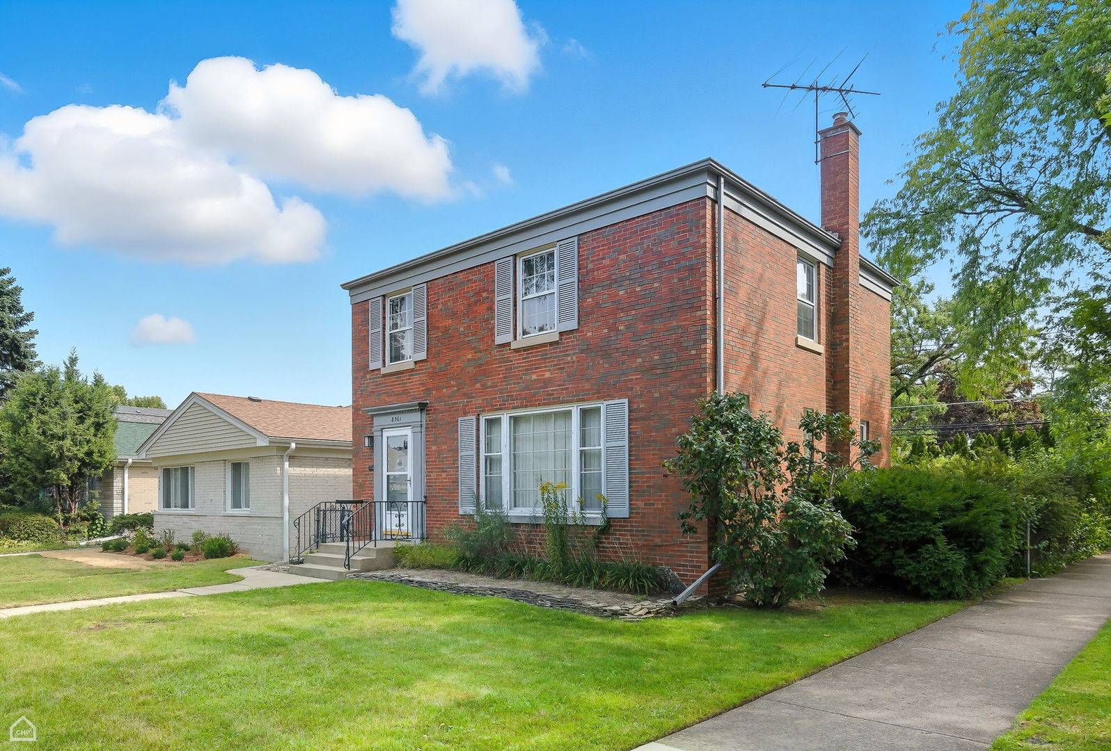 8301 Karlov Avenue Skokie, IL 60076 - Photo 2 of 21 a front view of a house with a yard