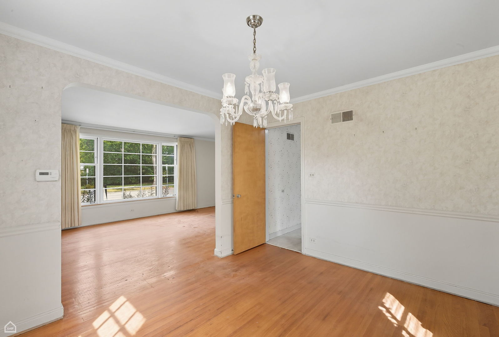 8301 Karlov Avenue Skokie, IL 60076 - Photo 5 of 21 a view of a room with window and chandelier