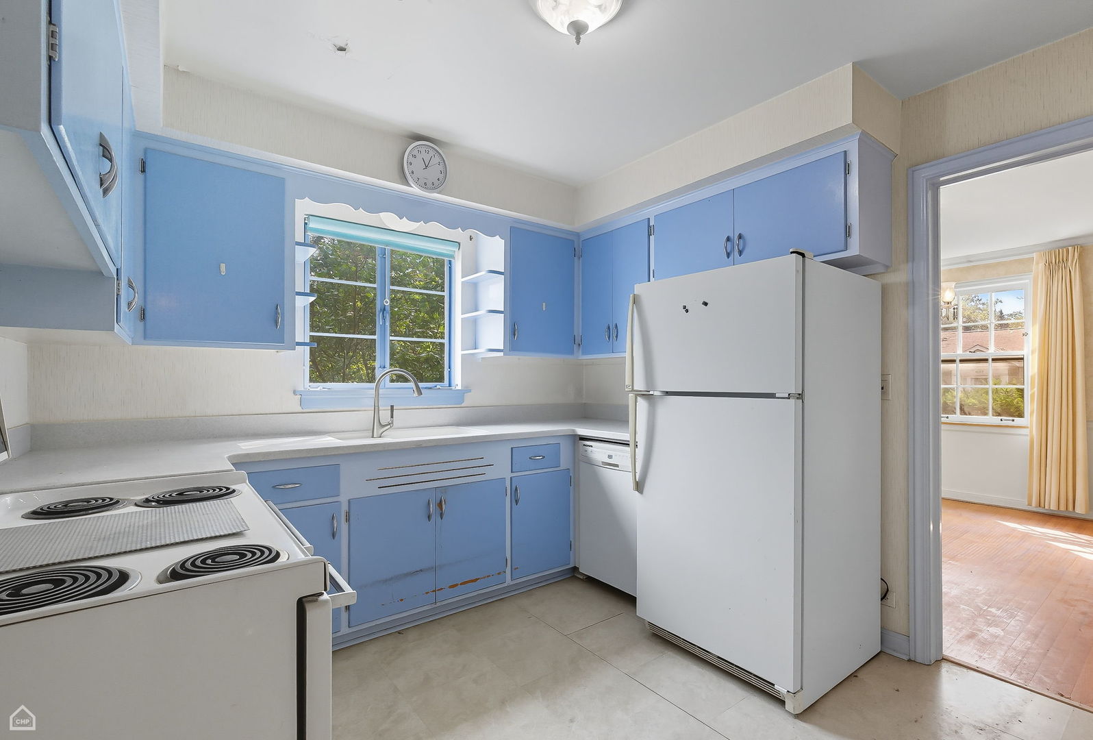 8301 Karlov Avenue Skokie, IL 60076 - Photo 6 of 21 a kitchen with a stove a refrigerator and a sink