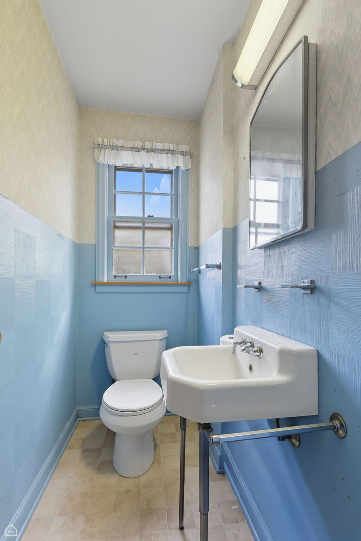 8301 Karlov Avenue Skokie, IL 60076 - Photo 7 of 21 a bathroom with a sink a toilet and mirror