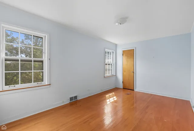 a view of empty room with windows